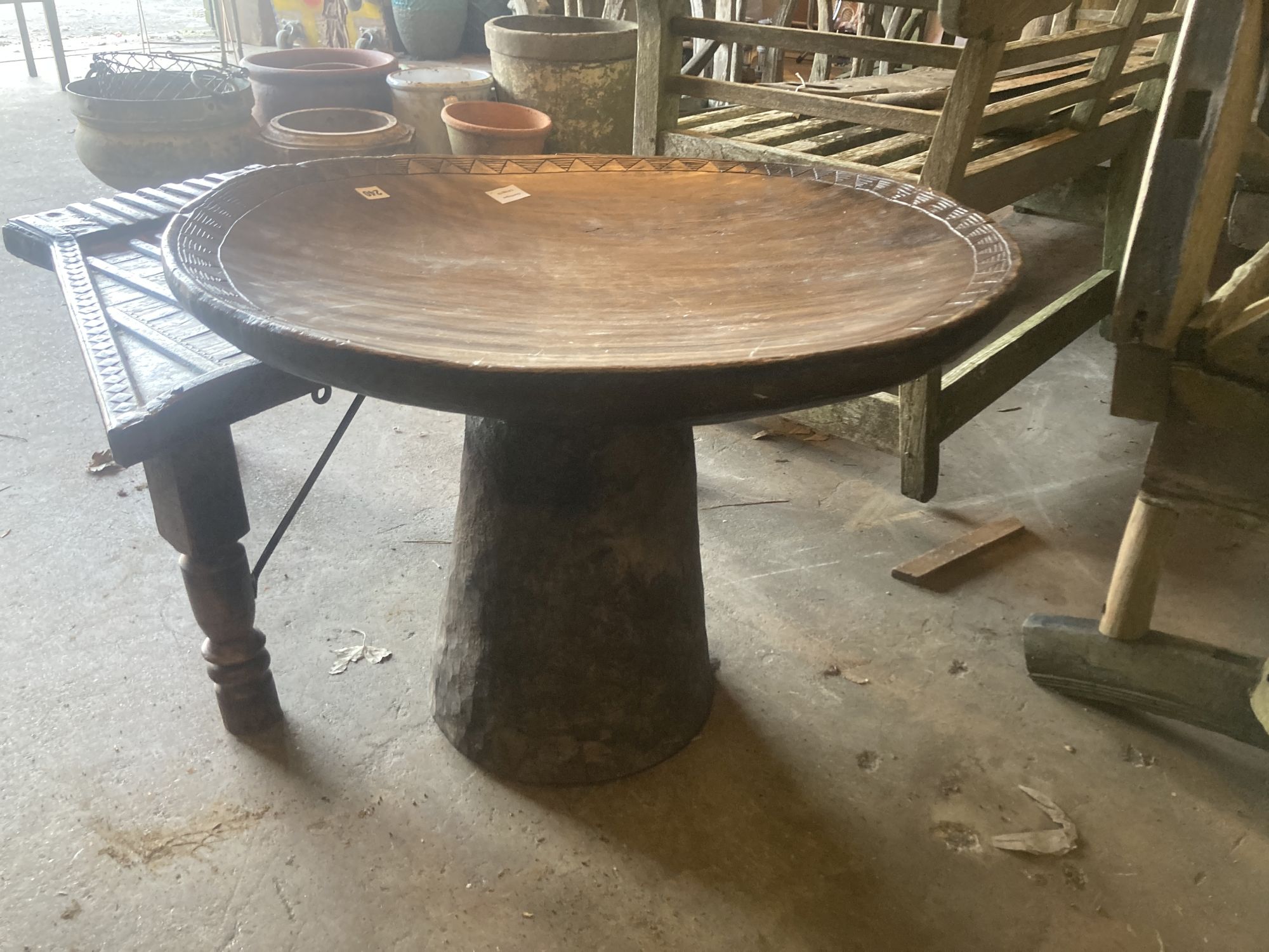 Two African carved hardwood tables, largest 72cm diameter 50cm high